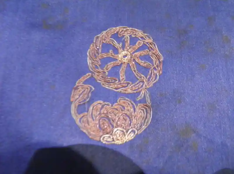 A solar disc embroidered on a Chinese robe